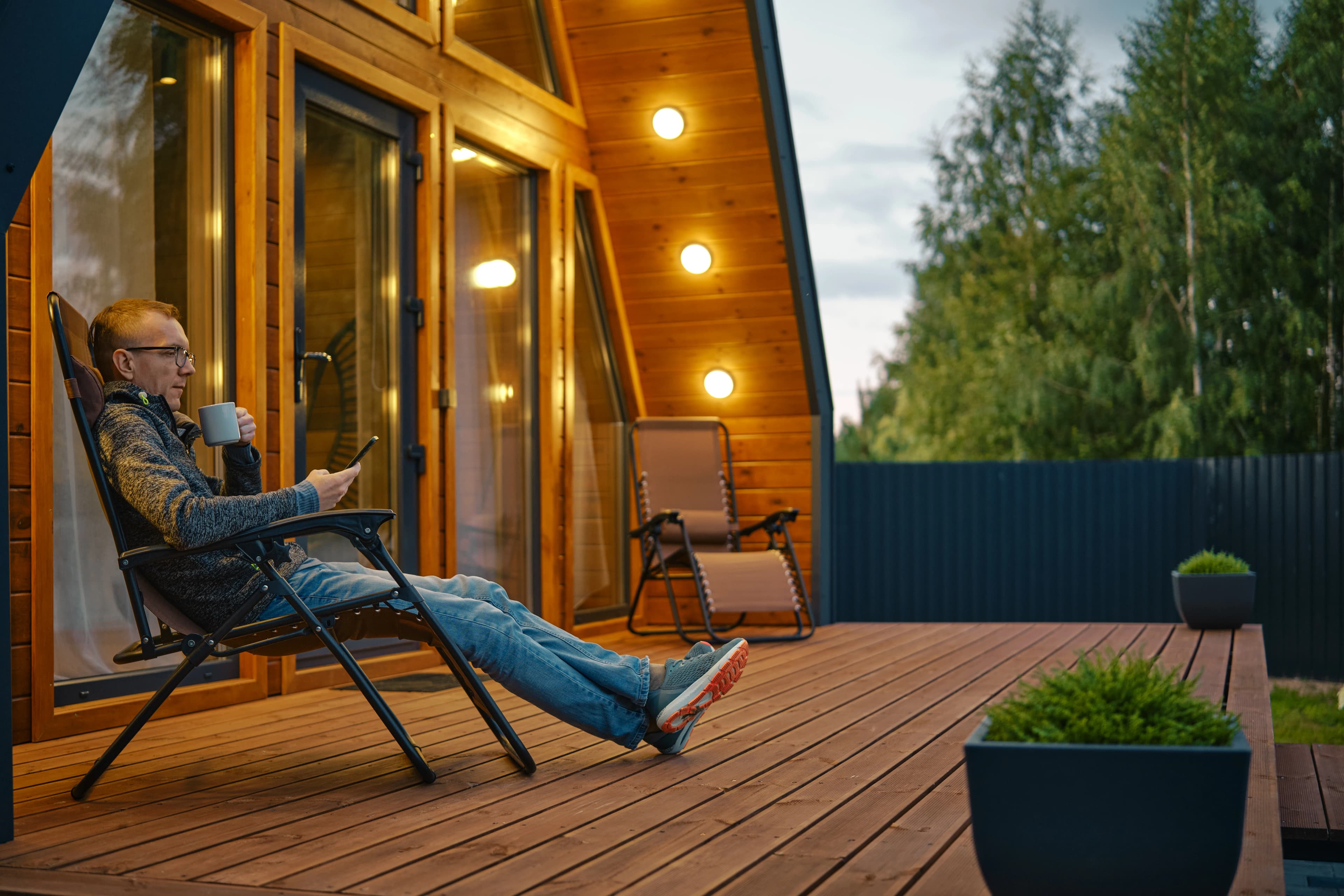 A beautiful modern cedar deck with outdoor furniture.