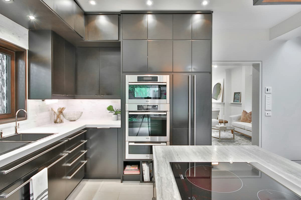Modern white kitchen with gold fixtures