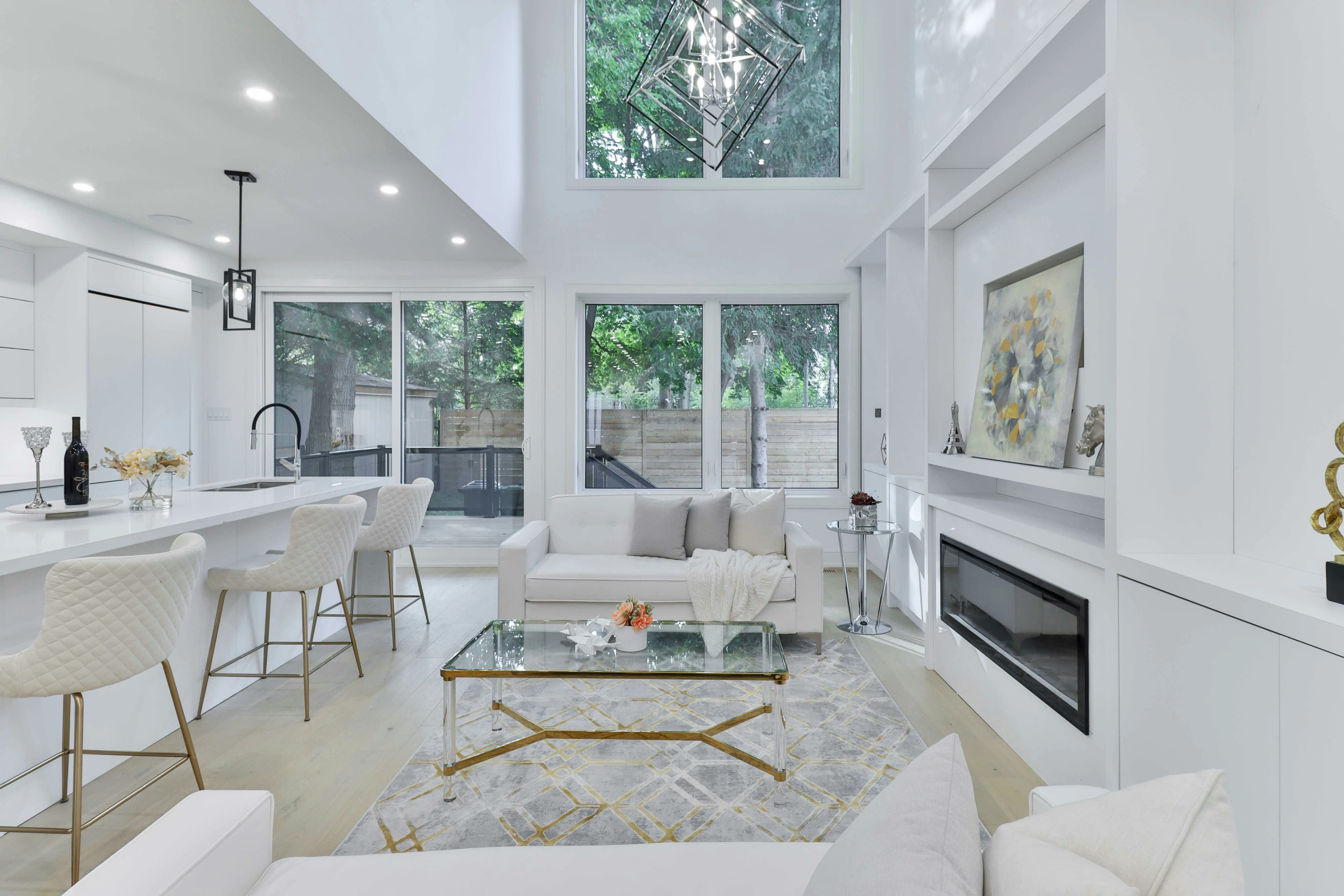 An open-concept living room and kitchen after a major home renovation.